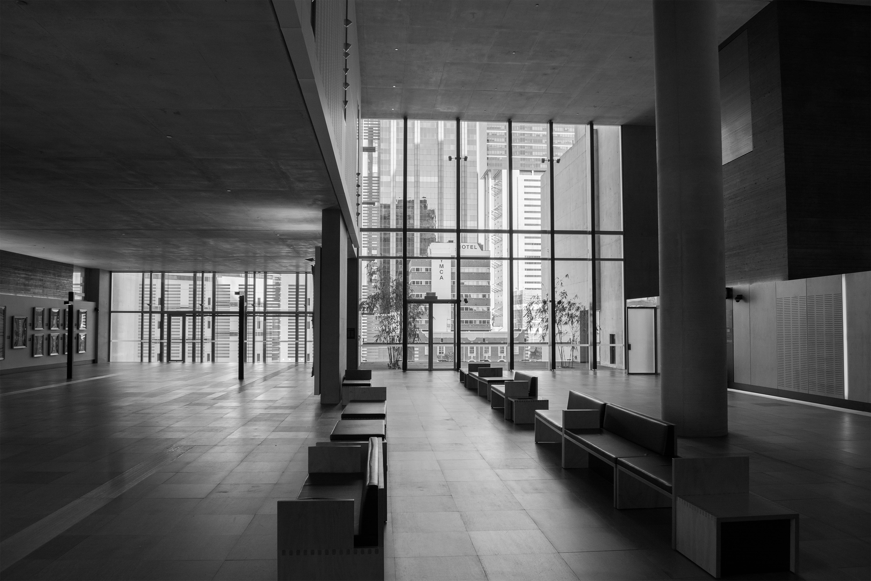 When designing the Queen Elizabeth II Courts of Law the objective was to create a calming place. Through the use of natural light, wood, concrete and black finishes this objective is achieved.