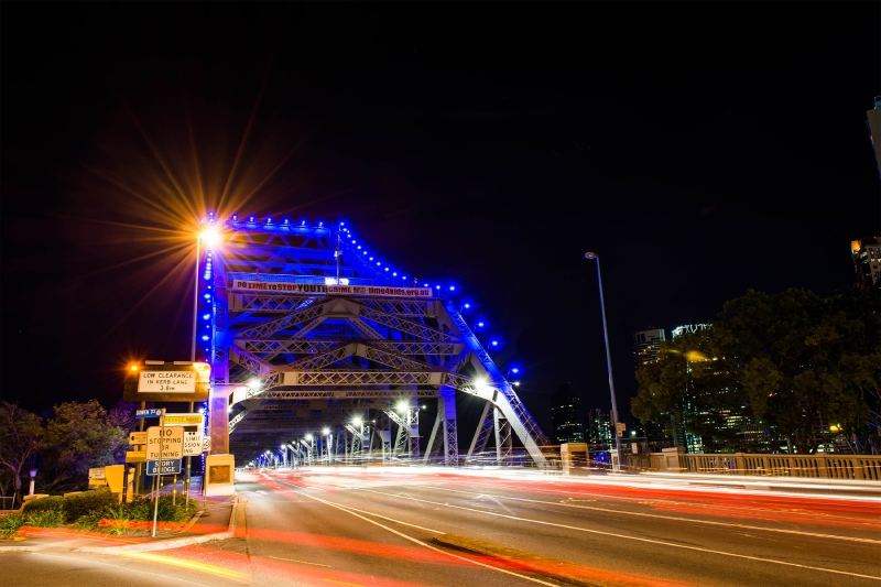 Cars Driving Across The Story Bridge At Night