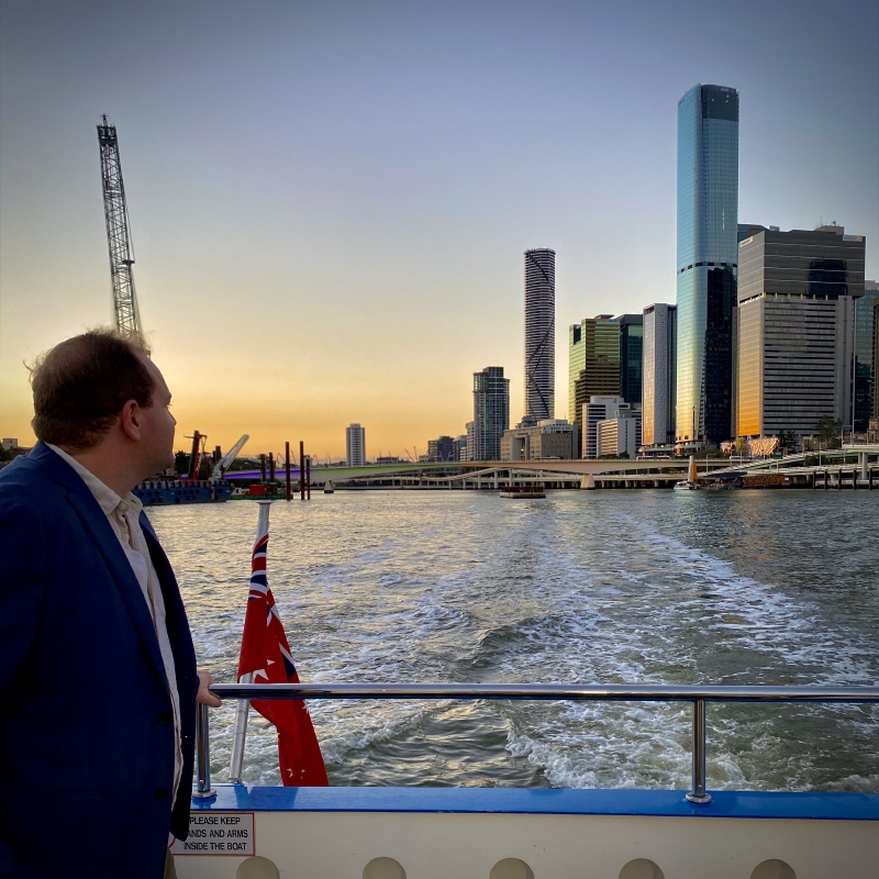 Sam Petherbridge looking off the back of a CityCat into the sunset at the end of a great weekend. Brisbane, Queensland, Australia. 21 August 2021